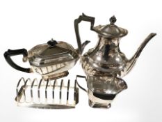 An EPNS three piece tea service and a nine bar toast rack.