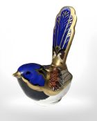 A Royal Crown Derby Fairy Wren paperweight with silver stopper.