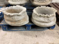 A pair of large 'sack' planters