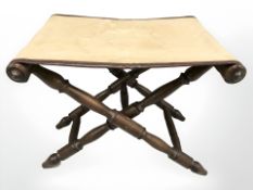 A turned beech X-frame stool