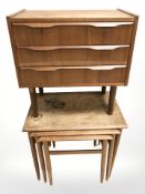 A 20th century Danish nest of three tables and a small three drawer chest,