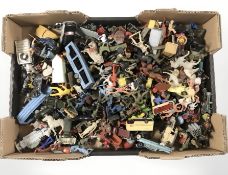 A large quantity of die cast metal and plastic model cars, miniature figurines, soldiers, etc.