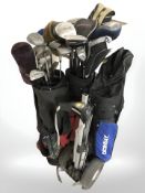 Three golf bags containing irons and drivers including Dunlop, Zucci,