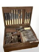 An oak canteen of EPNS cutlery.