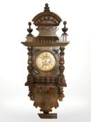 A 19th century continental walnut wall clock.