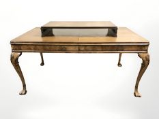 A 20th century carved walnut extending dining table with leaf, overall 205 cm x 95 cm x 75 cm,