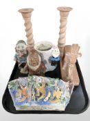 A pair of pottery candlesticks, further Egyptian style figure of a cow, Snow White figures,