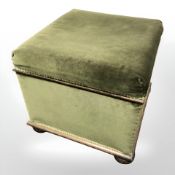 A green draylon upholstered storage chest, width 60 cm.
