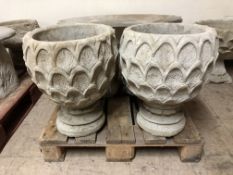 A pair of pineapple design urns