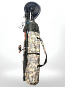 A fishing rod bag containing landing net, collapsible parasol,