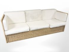 A 20th century wicker framed three seater settee,