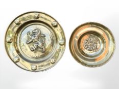 Two brass alms dishes, one depicting a rampant lion, the other the Yorkshire rose,