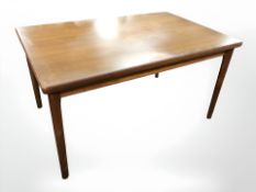 A 20th century teak dining table, 140 cm x 90 cm x 73 cm, together with a set of four dining chairs.