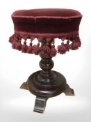A 19th century mahogany foostool in tassled fabric,