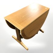 A teak veneered dropleaf occasional table, width 60 cm.