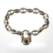 An antique gold enamel and cabochon moonstone bracelet CONDITION REPORT: 25.