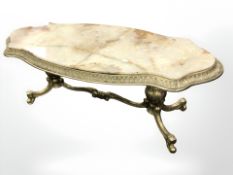 A heavy cast brass shaped coffee table with onyx top,