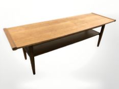 A 20th century teak rectangular two tier coffee table, length 114 cm.
