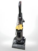 A Dyson DC 33 upright vacuum cleaner