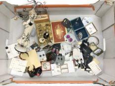 A group of modern costume jewellery, earrings, mannequin jewellery display stand,