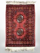 A Turkoman rug, Afghanistan, 76 cm x 44 cm.