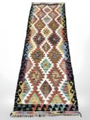 A Chobi Kilim runner, 244 cm x 78 cm.