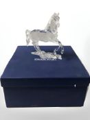 A Swarovski crystal figure of a prancing horse, height 14.5 cm, boxed.
