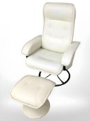 A 20th century stitched cream leather swivel armchair and similar footstool