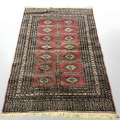 A Lahore Bokhara rug, Pakistan, 200 cm x 130 cm.