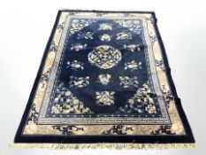 A Chinese rug, 240 cm x 168 cm.