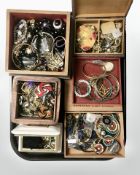 A tray of contemporary jewellery boxes and their contents comprising bangles, bead necklaces,