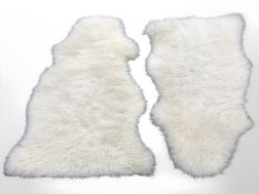 Two sheep skin rugs,