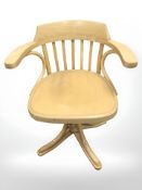 A contemporary bentwood swivel armchair.