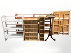 An group of open bookshelves, folding tables,