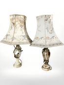 Two polished onyx table lamps with shades,