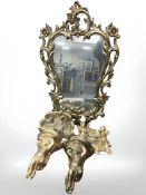 An ornate gilt resin mirror, height 90 cm together with a pair of composition cherub brackets,