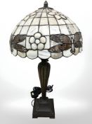 A Tiffany style patinated metal table lamp with dragonfly shade, height 55 cm.
