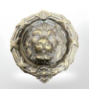 A large cast brass lion mask door knocker,