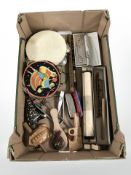 A group of musical instruments including recorders, a Hero harmonica, tambourines, a pianola roll,