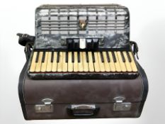 A Parrot piano accordion, in travel case.