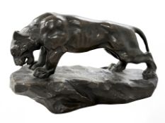 A French cast patinated bronze figure of a lion, circa 1900,
