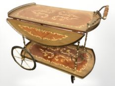A 20th century Italian marquetry veneered drinks trolley, length 83 cm.