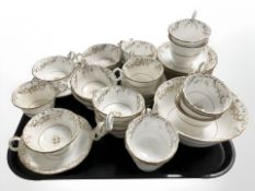 Thirty four pieces of gilded tea china