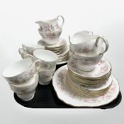 A Colclough twenty one piece floral decorated tea service and a further Springfield twenty one