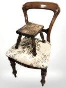 A Victorian mahogany dining chair and a small oak stool.