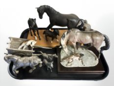 A group of ceramic and metal horse ornaments