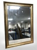 A reproduction gilt framed mirror, 102 cm x 72 cm.