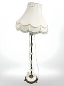 A metal and onyx standard lamp.