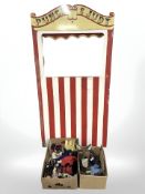 A Punch and Judy theatre stand and two boxes of assorted puppets, stand 164 cm x 91 cm.