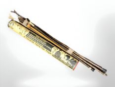 A Yard of Ale drinking glass in tube, together with a bundle of walking sticks,